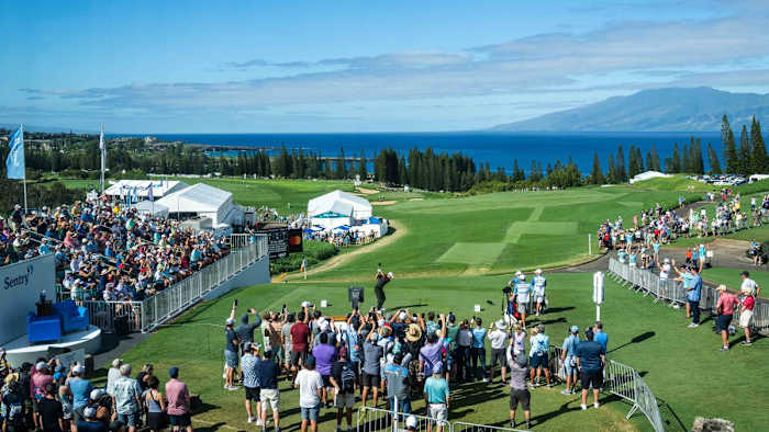 Collin Morikawa tees off on the first hole during the final round of the 2023 Sentry Tournament of Champions on The Plantation Course at Kapalua Lahaina, Maui, Hawaii.
